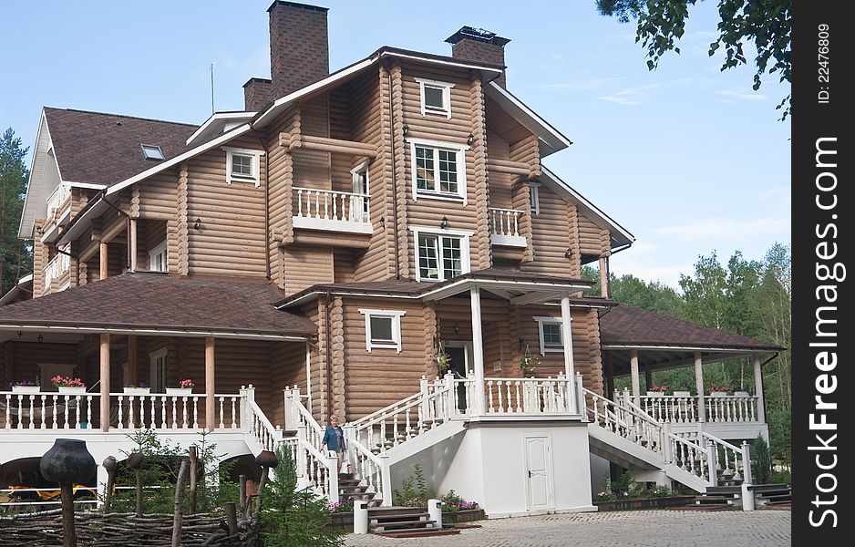 The facade of a wooden cottage. The facade of a wooden cottage