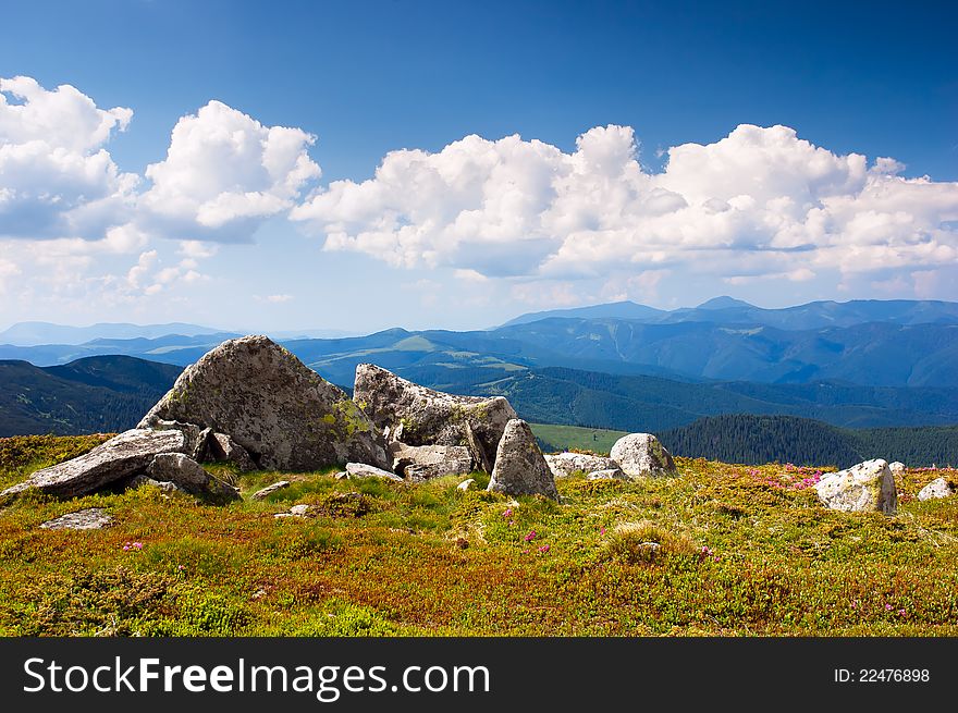 Summer sunny landscape with a cloudy sky. Ukraine, the Carpathian mountains. Summer sunny landscape with a cloudy sky. Ukraine, the Carpathian mountains.