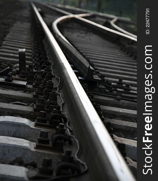 Train tracks crossroad in an industrial park near Győr, Hungary