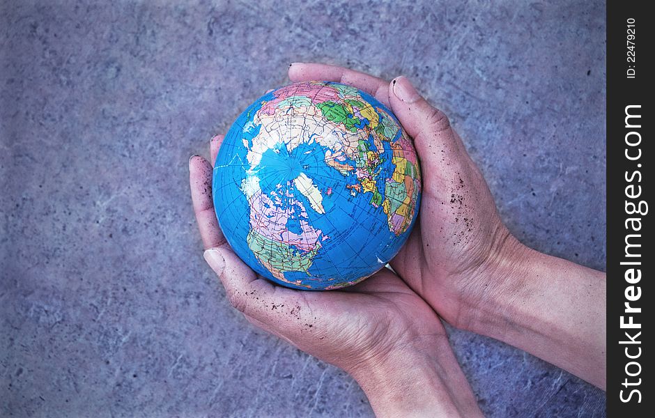 Hands holding an atlas globe. Hands holding an atlas globe