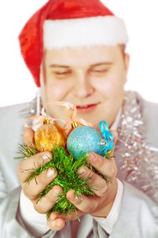 Young Man Holds Christmas Toys. Stock Photos Young Man Holds Christmas Toys. Stock Photos