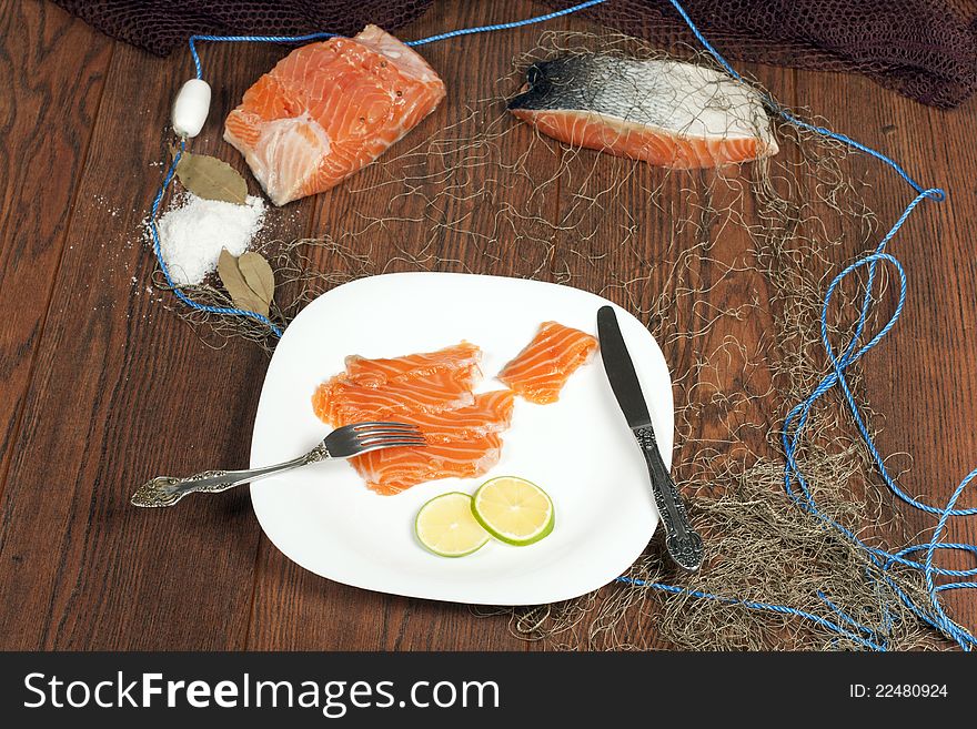 Still life with salmon and slices of lime Norwegian. Still life with salmon and slices of lime Norwegian
