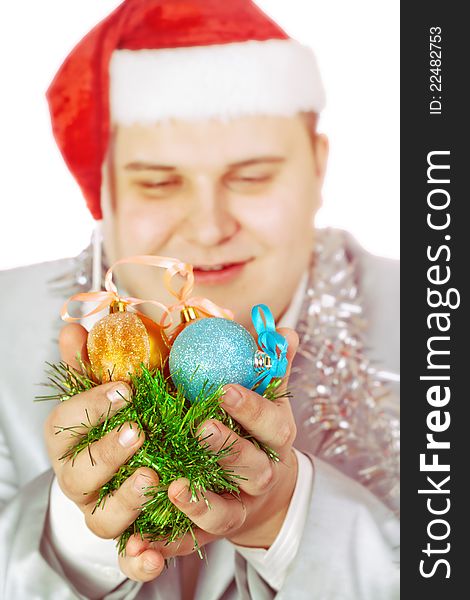 Young man holds Christmas toys. on white background.Soft focus.