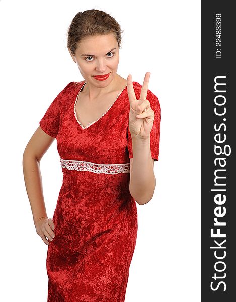 The woman in a red dress showing two fingers of a hand. The woman in a red dress showing two fingers of a hand