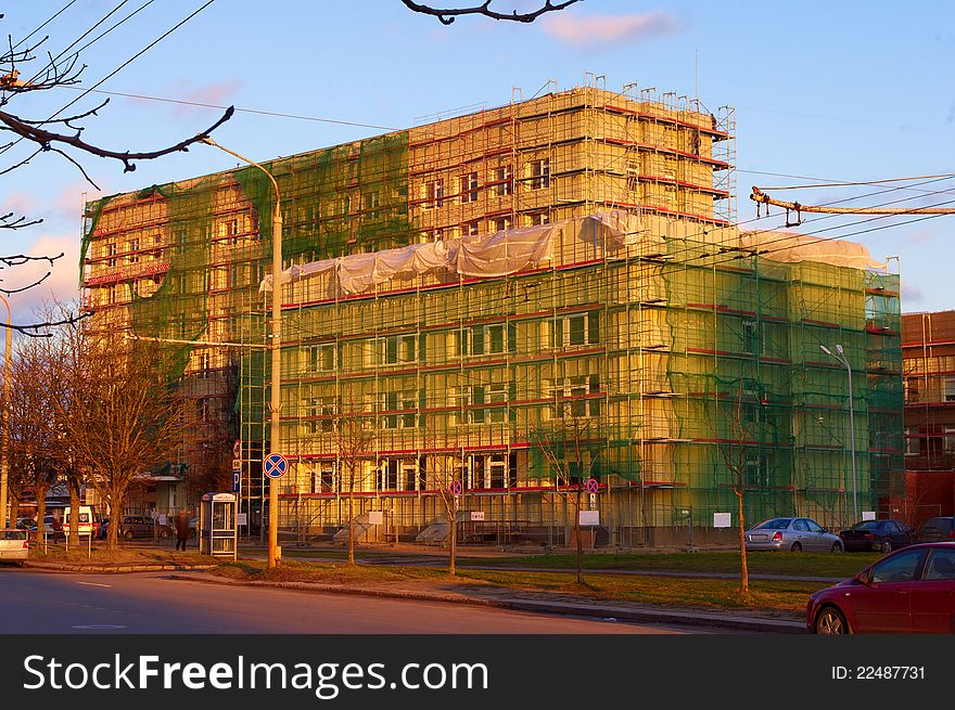 Building renovation works in town street, horizontal imge