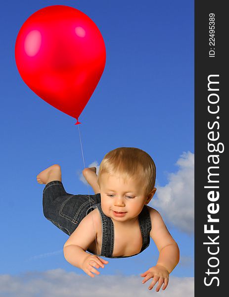 A little boy wearing a farmer's outfit and floating in the sky with a red balloon. A little boy wearing a farmer's outfit and floating in the sky with a red balloon.