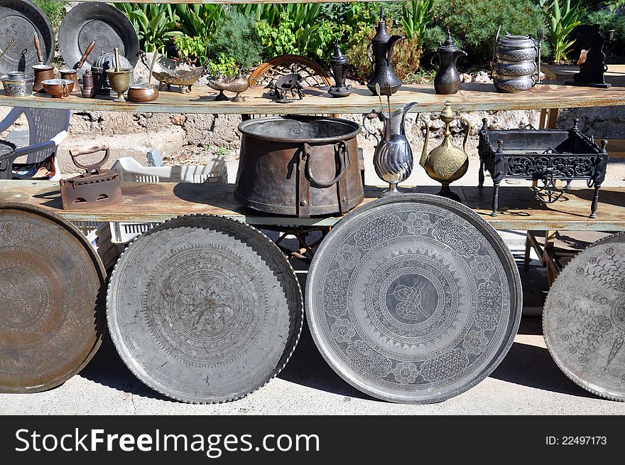 Metalware on display in a outdoor antique market