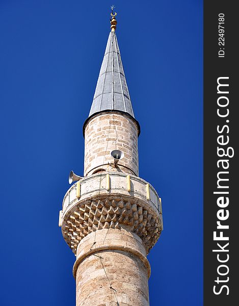 The minarete at a mosque showing the loudspeakers used to call followers to prayer. The minarete at a mosque showing the loudspeakers used to call followers to prayer