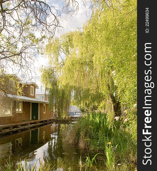 Houseboat  with reflections on a lake.