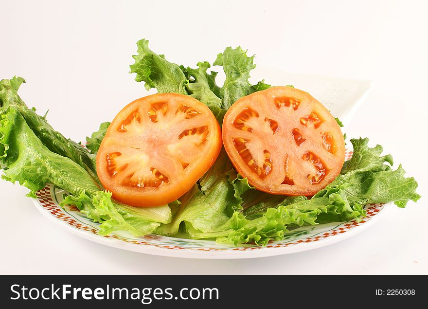 Photo of vegetables tomatoe and green lettuce. Photo of vegetables tomatoe and green lettuce