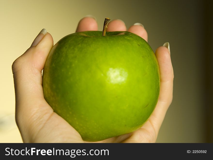 Handing holding a healthy apple. Handing holding a healthy apple