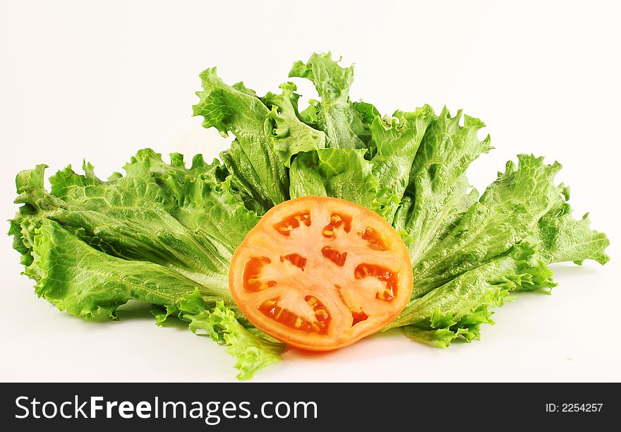 Photo of vegetables tomatoe and green lettuce. Photo of vegetables tomatoe and green lettuce