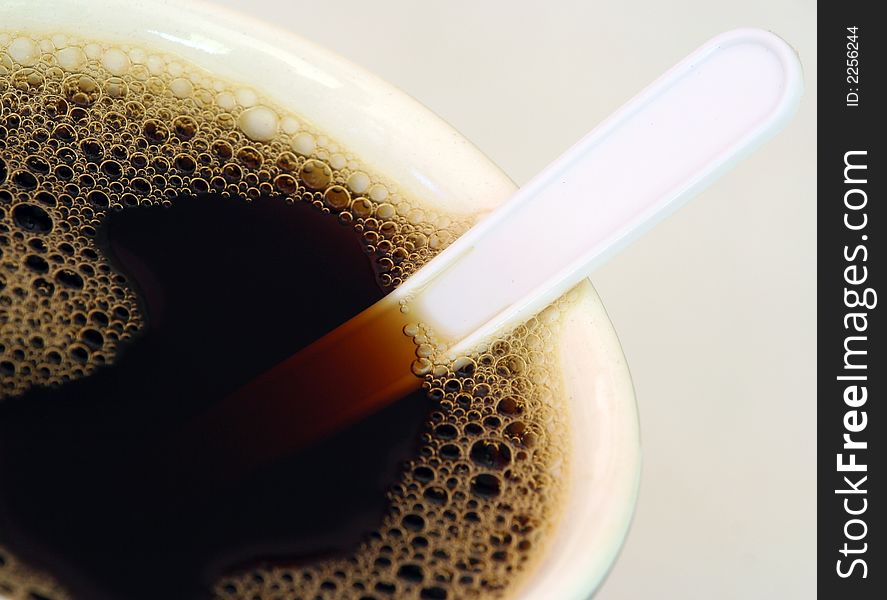 A cup of fresh black coffee.