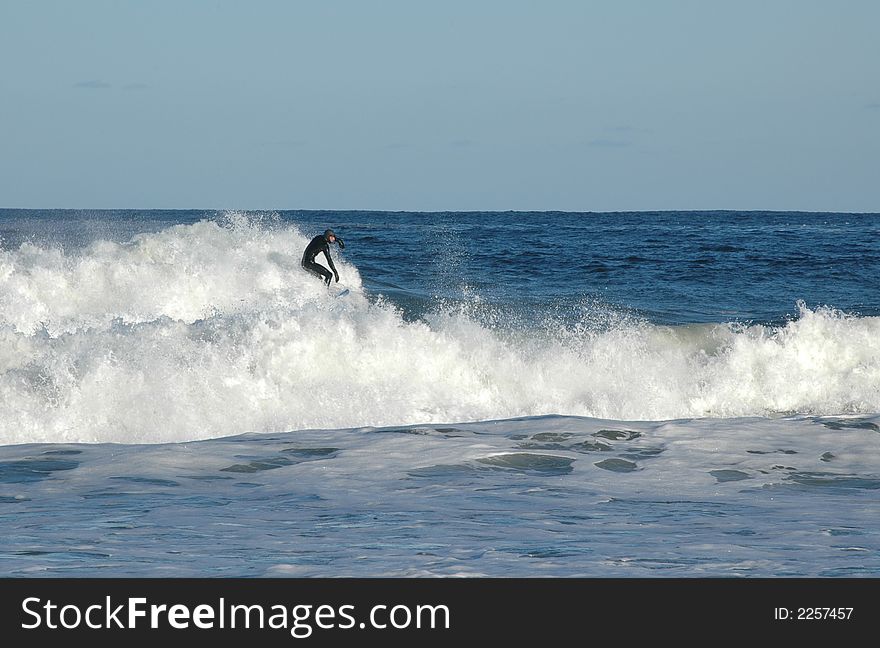 Surfer riding the waves on the Atlantic coast