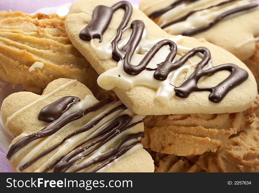 Figured shortcake cookies glazed by chocolate and sugar