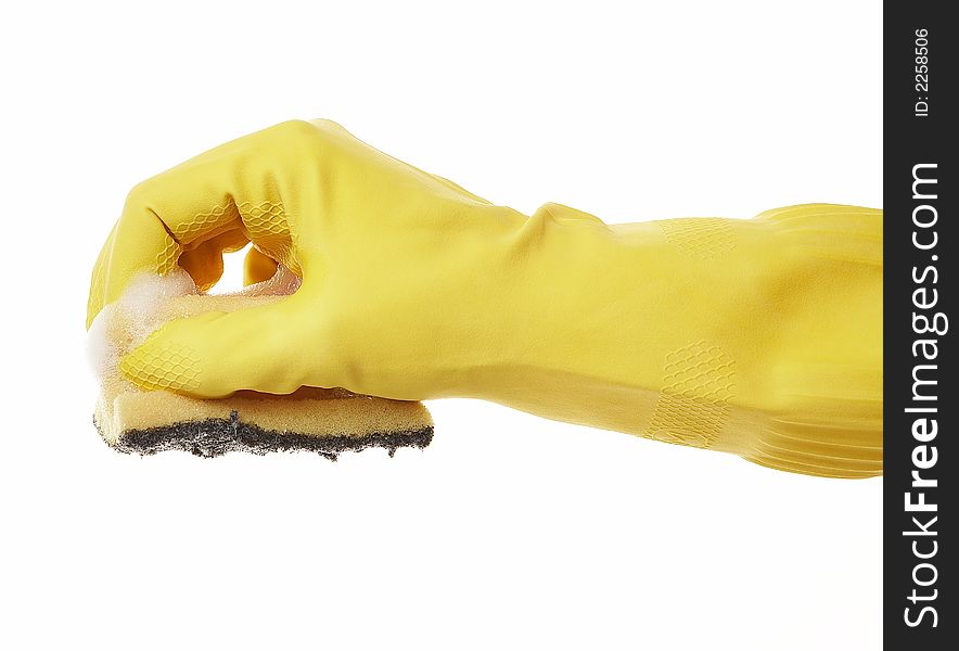Hand in yellow rubber glove with yellow sponge and foam. Hand in yellow rubber glove with yellow sponge and foam