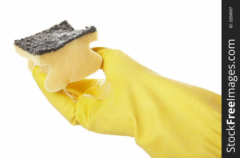 Hand in yellow rubber glove with yellow sponge and foam. Hand in yellow rubber glove with yellow sponge and foam