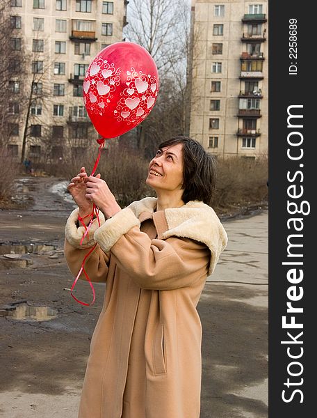 The woman with a red air-balloon. The woman with a red air-balloon