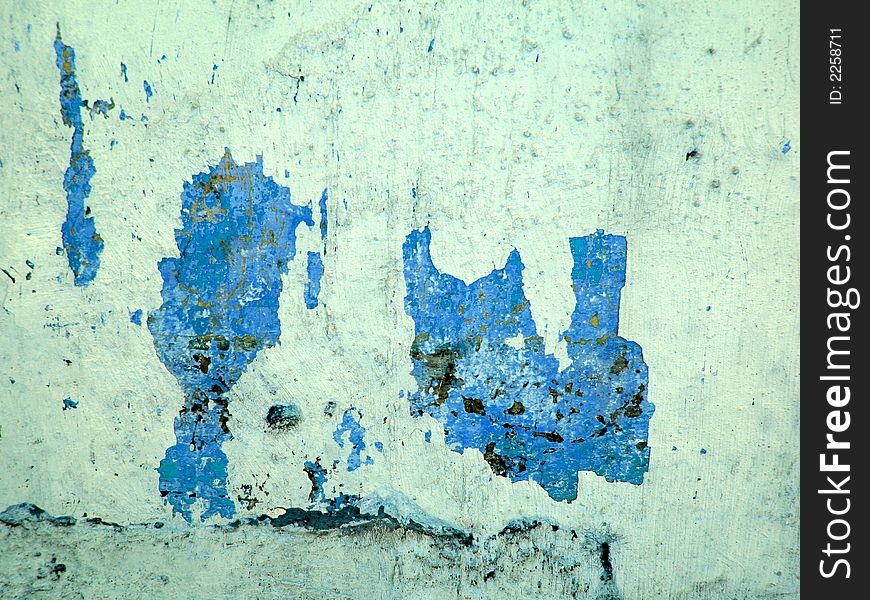 Grunge wall with peeling blue paint. Grunge wall with peeling blue paint