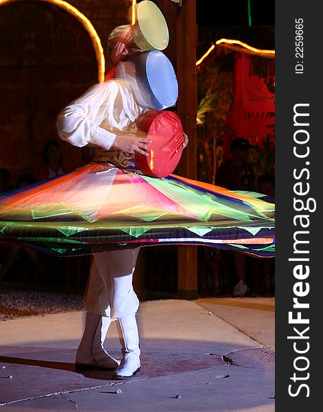 Egyptian Folkloric Tanoura Dancer, motion night photography