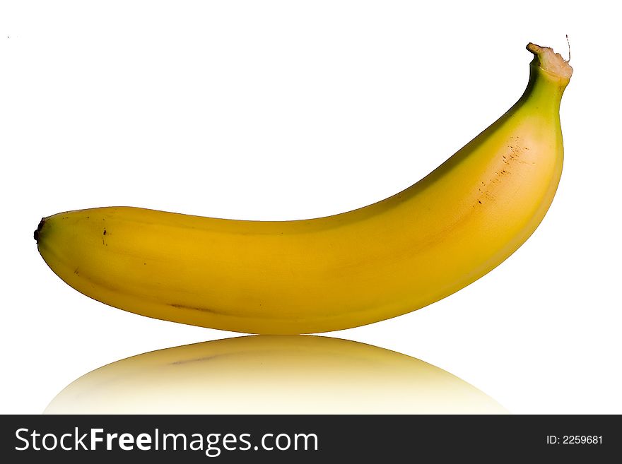 Yellow banana with reflex in the floor on white background. Yellow banana with reflex in the floor on white background.