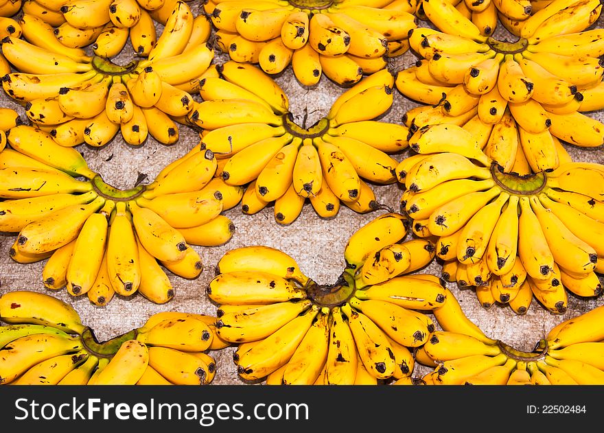 A lot of egg bananas on the floor. A lot of egg bananas on the floor.