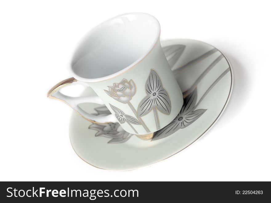 Empty cup and saucer  with pattern isolated