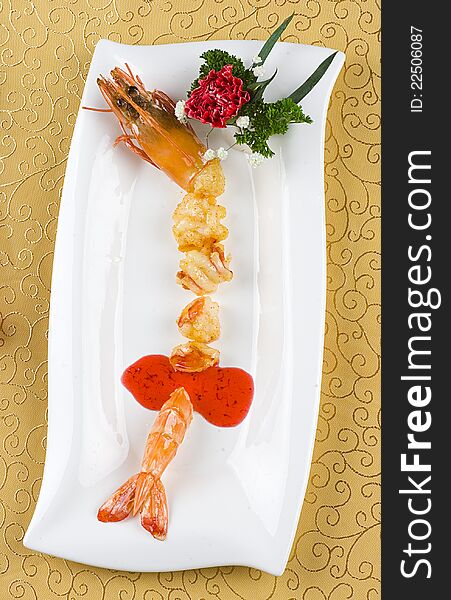 Gourmet food cheese on white plate prawns. Gourmet food cheese on white plate prawns