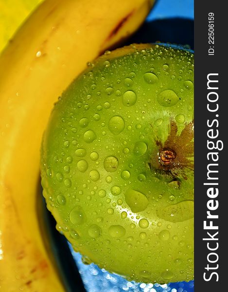 Close up of water droplets on green apple