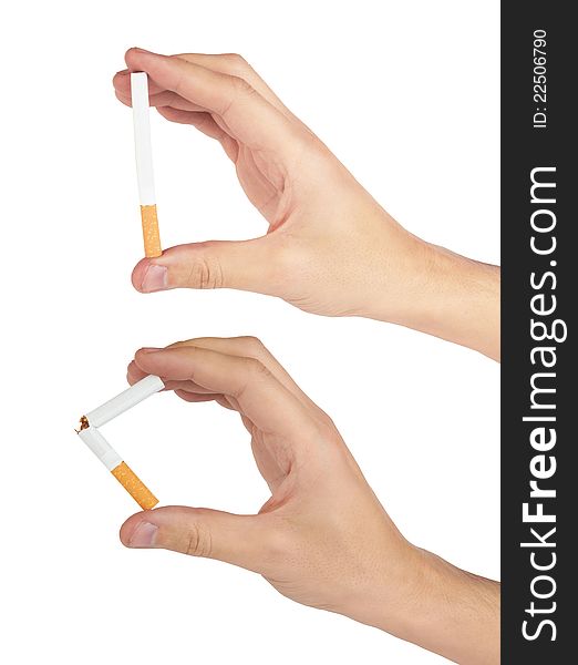 Mans hand breaking and holding a cigarette it is isolated on a white background.
