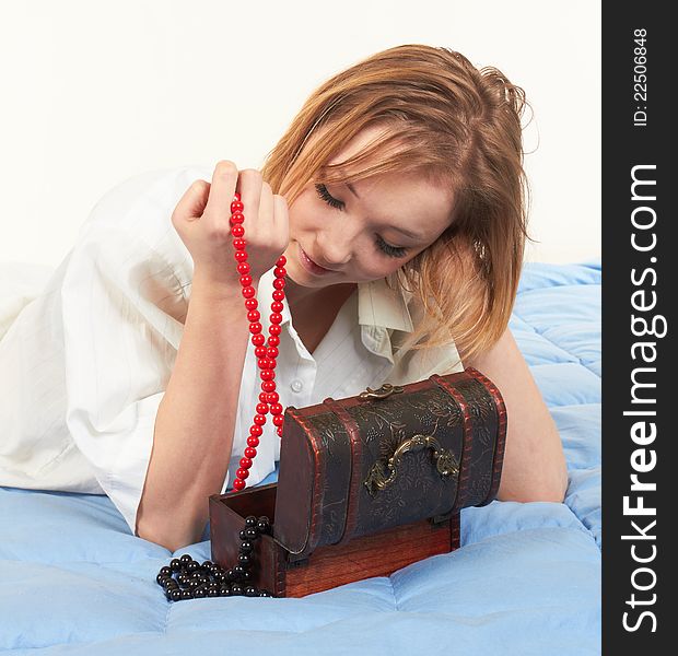 Beautiful young woman with wooden jewelry box. Beautiful young woman with wooden jewelry box