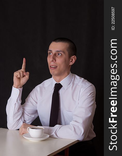 Inspirated businessman drinking coffee