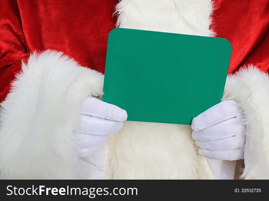 Santa Claus holding a chalk board sign in his gloved hands.Write your own message. Santa Claus holding a chalk board sign in his gloved hands.Write your own message.