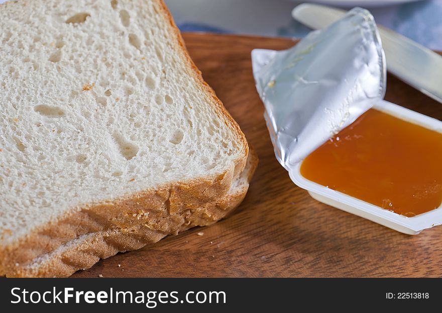 Delicious breakfast with bread and peach jam. Delicious breakfast with bread and peach jam