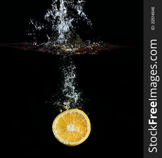 Orange in water splashes