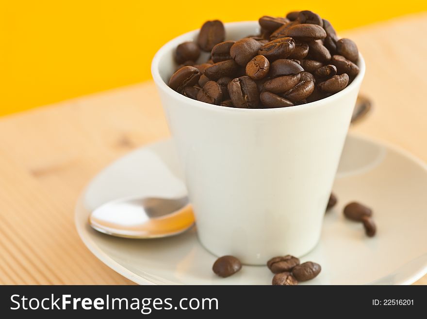 Coffee cup with coffee beans inside. Coffee cup with coffee beans inside