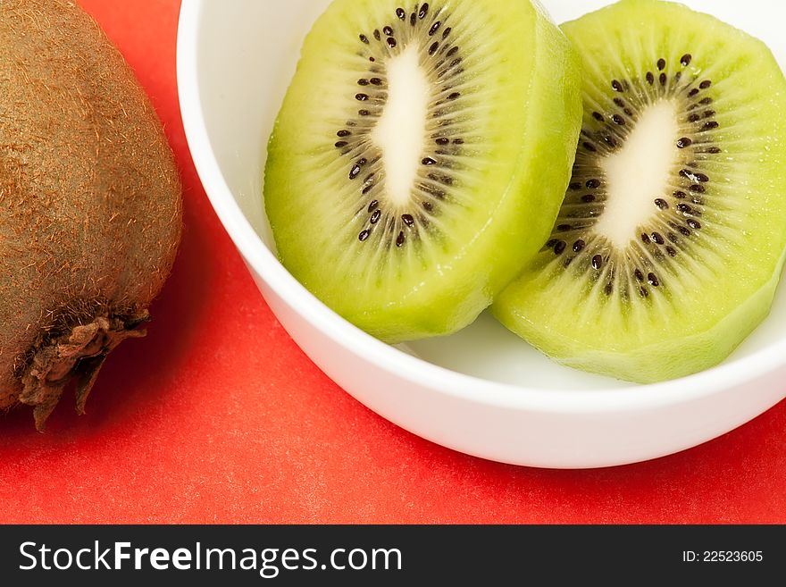 Graphic composition with kiwi on red background. Graphic composition with kiwi on red background