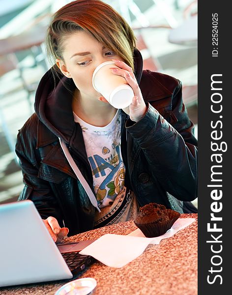 Girl With Cup And Muffin On The Terrace