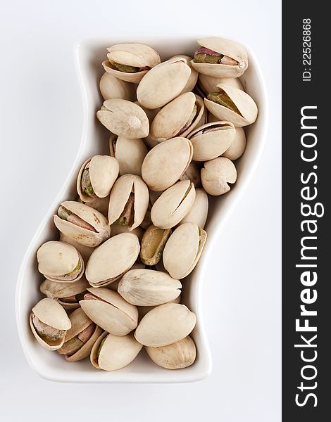 Pistachios on the white plate