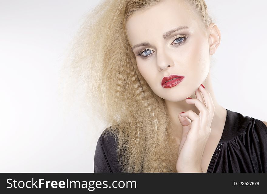 Young pretty woman with beautiful blond hairs and multicolor makeup isolated on white background