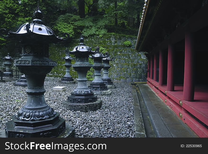 Row of stone lanterns on the lace of famous Rinnoji Temple in Nikko. Row of stone lanterns on the lace of famous Rinnoji Temple in Nikko