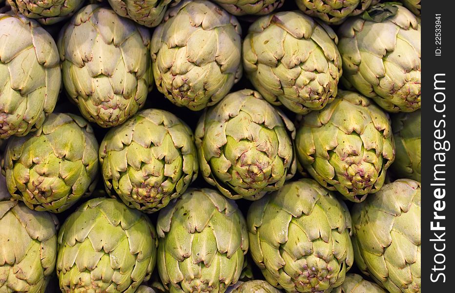 Freshly picked artichokes on display at the farmers market Boqueria, Barcelona.