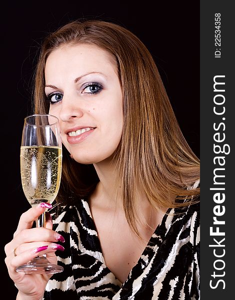 Beautiful woman enjoying a glass of pink champagne. Beautiful woman enjoying a glass of pink champagne