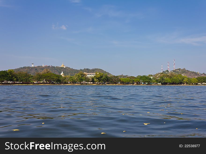 Temple on a hill looking over water in the Province of Thailand. Temple on a hill looking over water in the Province of Thailand.