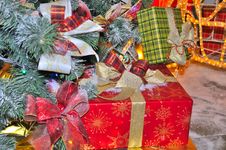 Boxes With Christmas Gifts Under Fir Tree Stock Photos