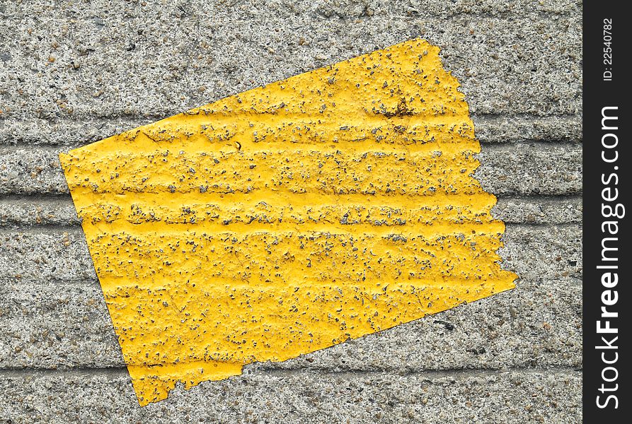 Old yellow sticker on old concrete background. Old yellow sticker on old concrete background