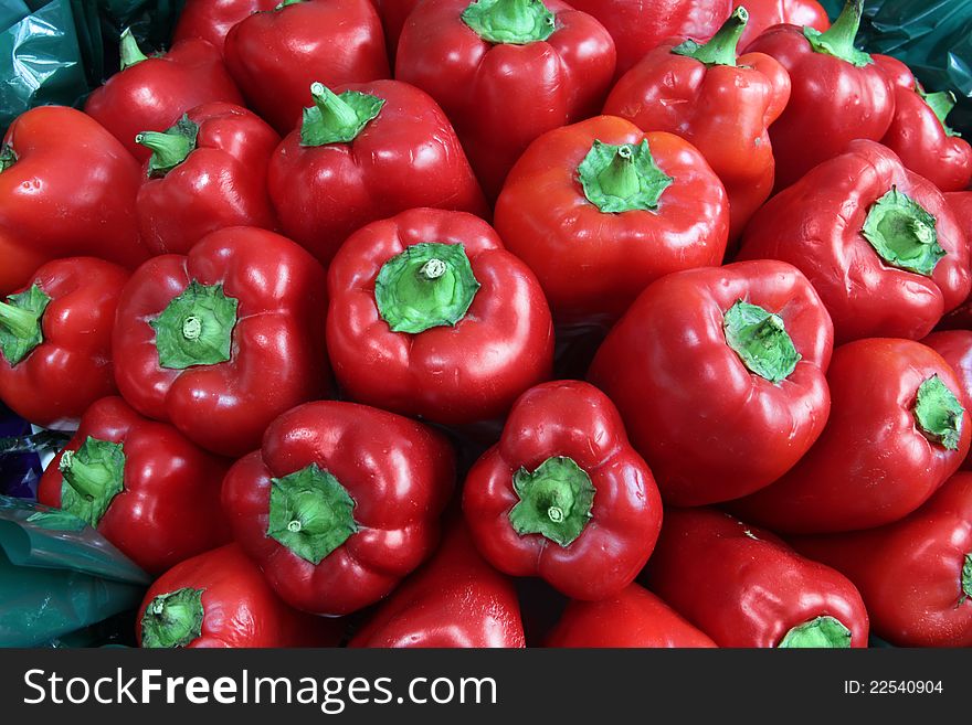 Red sweet peppers close up