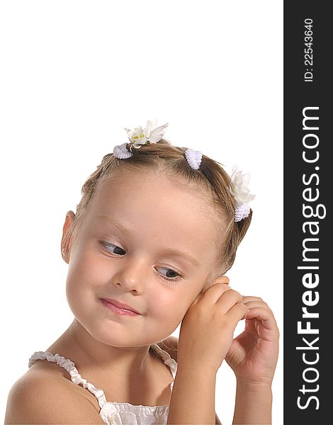 Beautiful little princess arranging her hair with nice hair-slides isolated on white background. Beautiful little princess arranging her hair with nice hair-slides isolated on white background