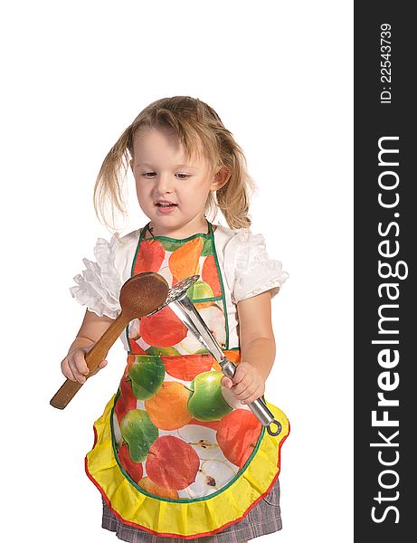 Nice little housewife with disheveled hair wearing colourful apron playing with kitchen appliances isolated on white background. Nice little housewife with disheveled hair wearing colourful apron playing with kitchen appliances isolated on white background