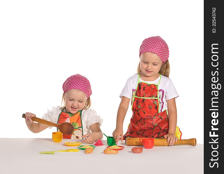 Two Little Housewifes In Colourful Aprons